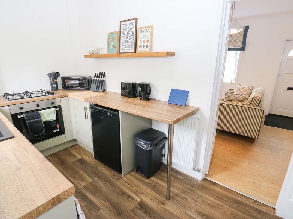 A kitchen with appliances and utensils at Saltaire House in Saltaire