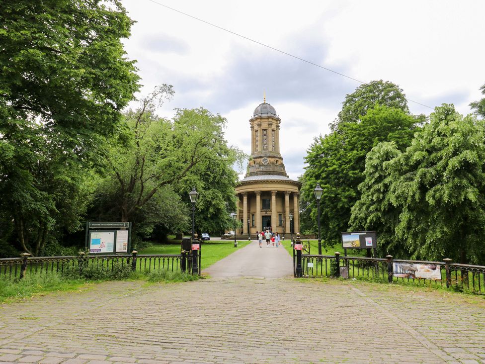 A park pathway leading to a building at Saltaire House in Saltaire
