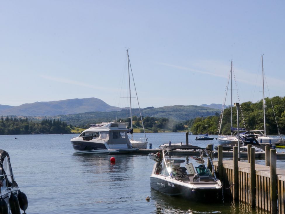 Boats on water with mountains in the background at 51 Calgarth Park, Troutbeck