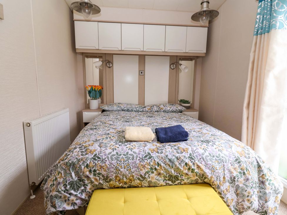 A bedroom with a bed and bedside table at 15 Cherry Tree walk Rhyl