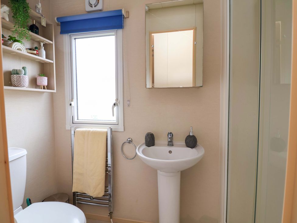 A bathroom with a sink and toilet at 15 Cherry Tree walk in Rhyl