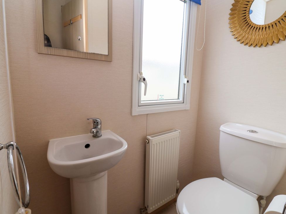 A bathroom with sink and toilet at 15 Cherry Tree walk in Rhyl
