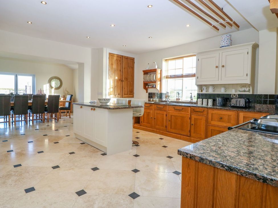 A kitchen with countertops and a dining area at Tuft House in Hovingham