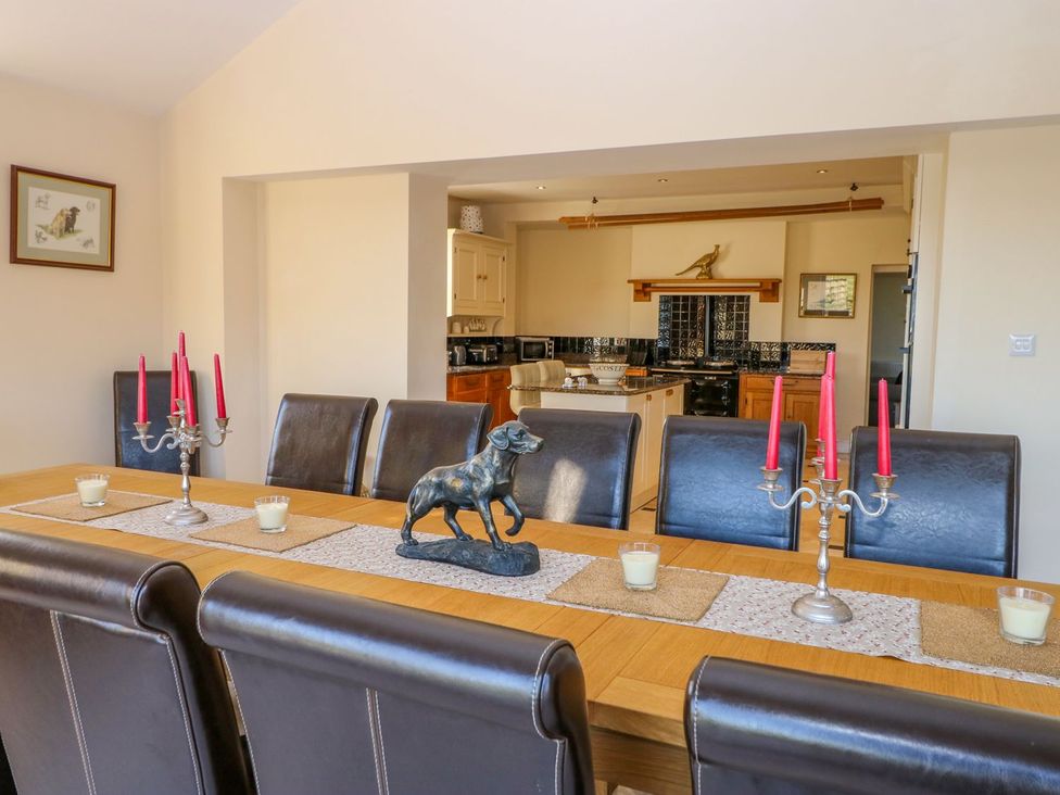 A dining room with a table and seating at Tuft House in Hovingham
