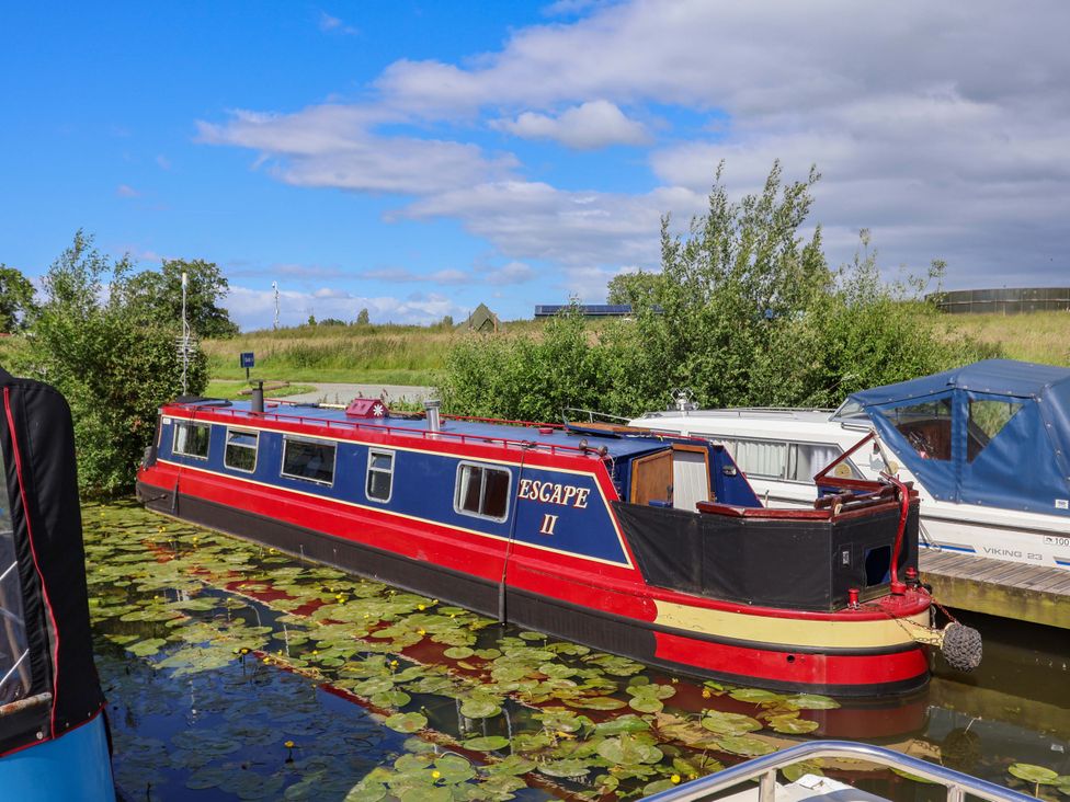 A boat named Escape II on the water at Oakwood Marina