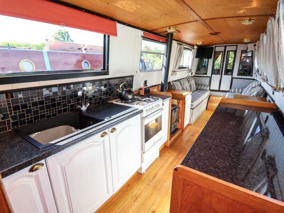 A kitchen with a sink and stove at Escape II in Oakwood Marina