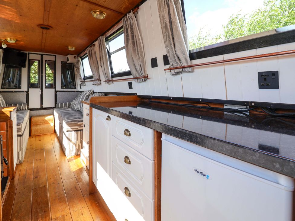 A kitchen with fridge and counter at Escape II in Oakwood Marina