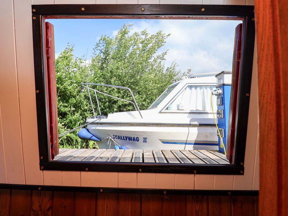 A view of a boat from a window at Escape II Oakwood Marina