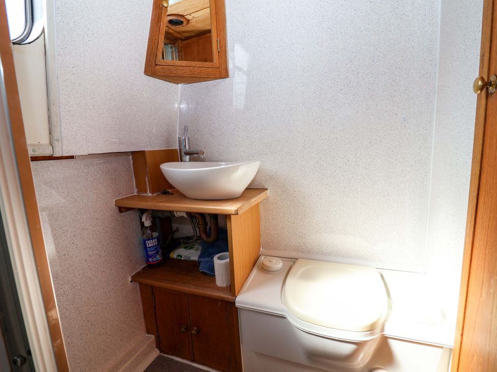 A bathroom with a sink and toilet at Escape II in Oakwood Marina