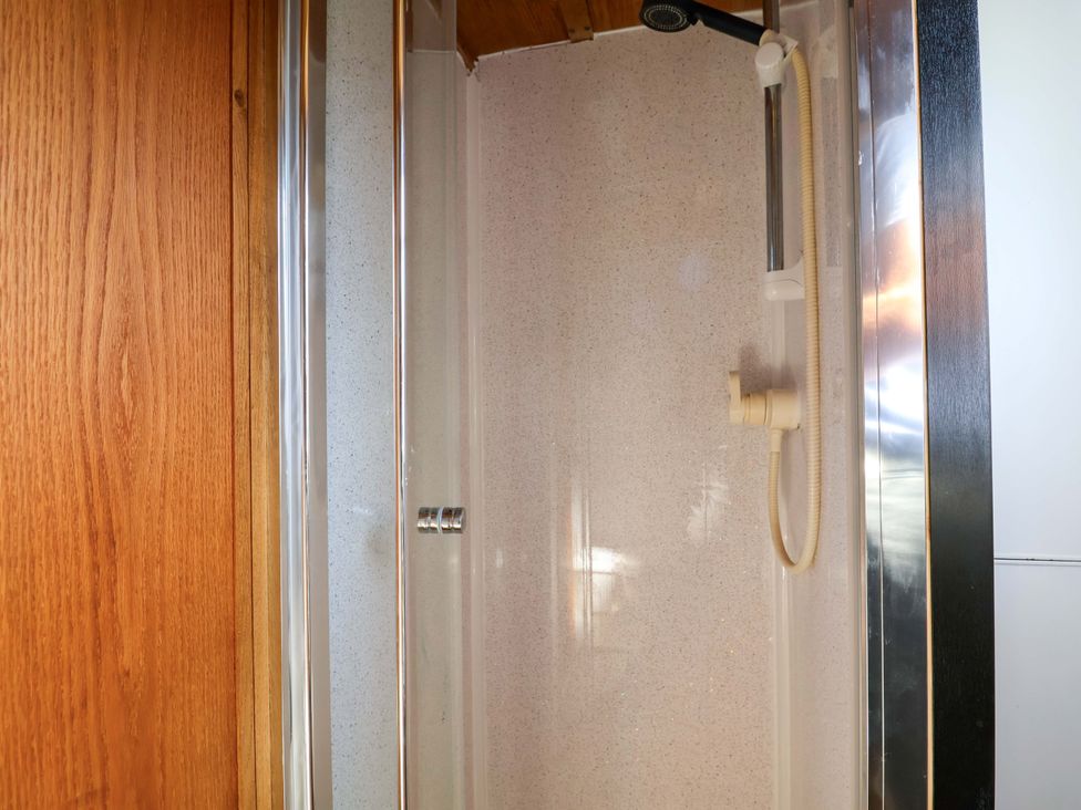 A shower with a showerhead and interior wall at Escape II Oakwood Marina
