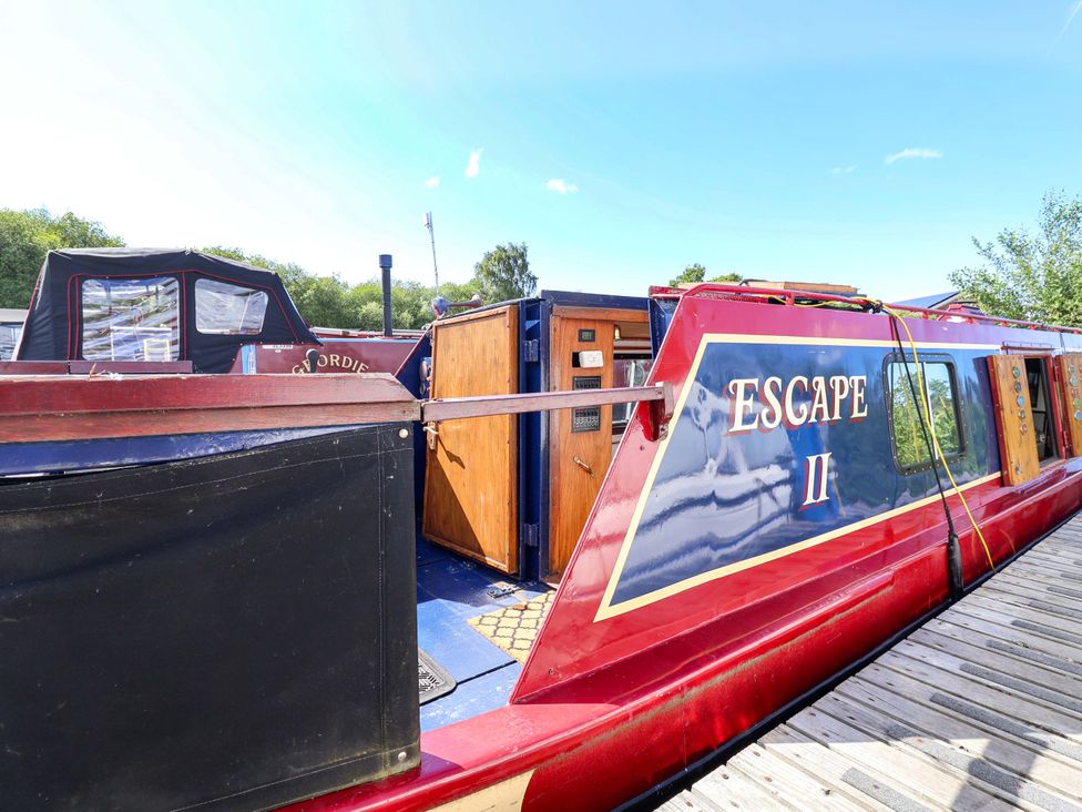 A houseboat named Escape II at Oakwood Marina