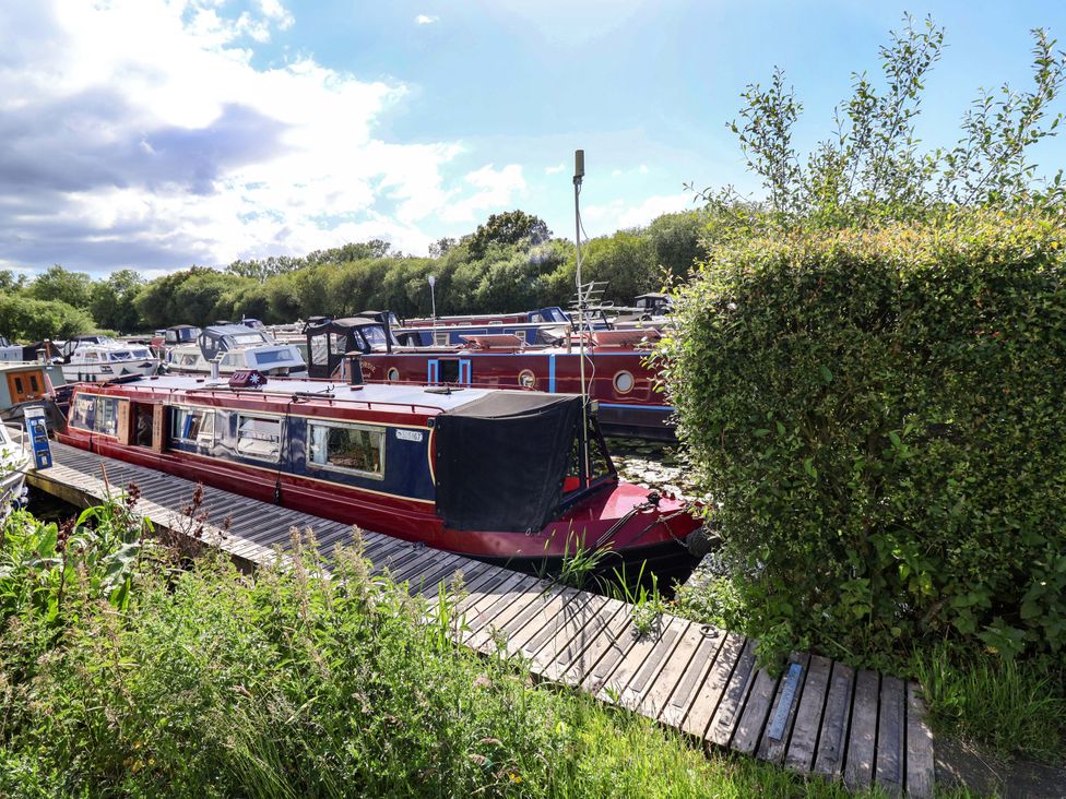 A boat docked near other boats at Escape II in Oakwood Marina
