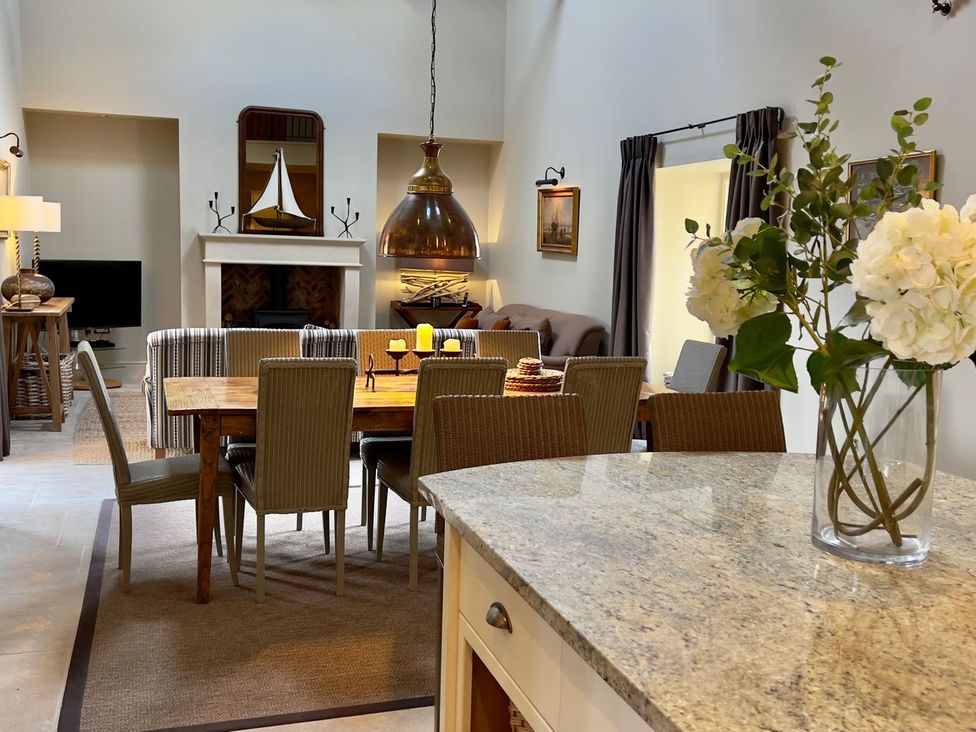 A dining room with a table and chairs at The Chimney in Bamburgh