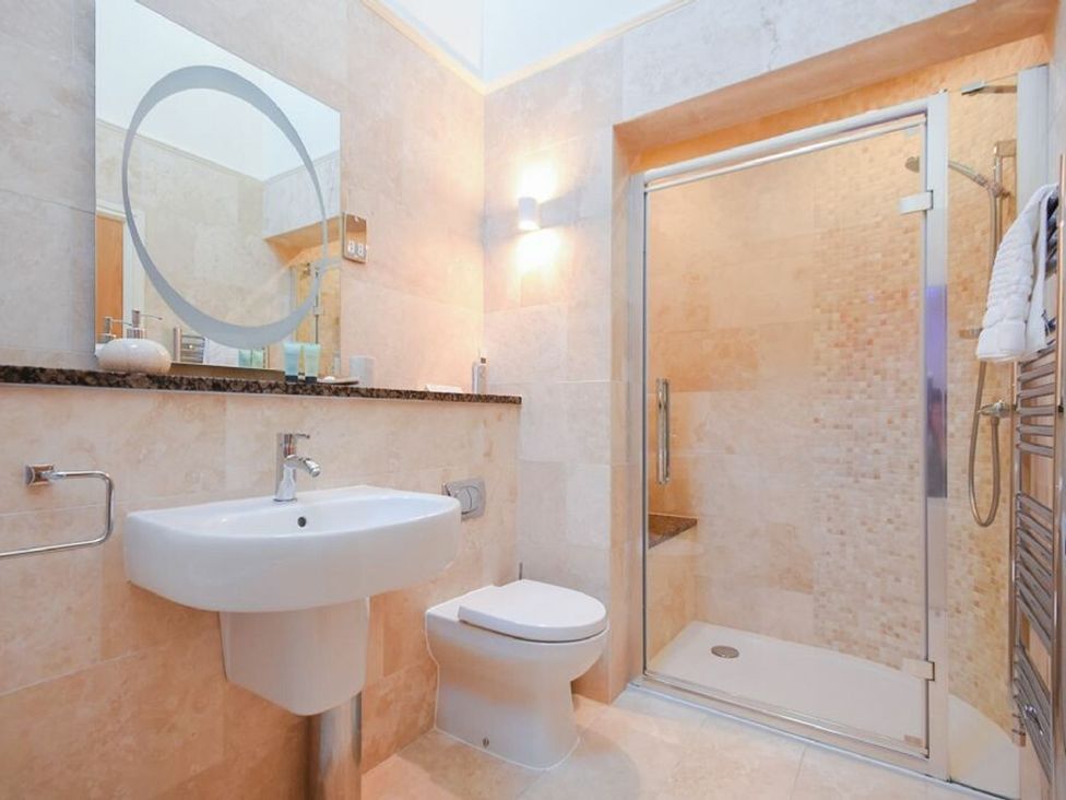 A bathroom with a sink and shower at The Chimney in Bamburgh