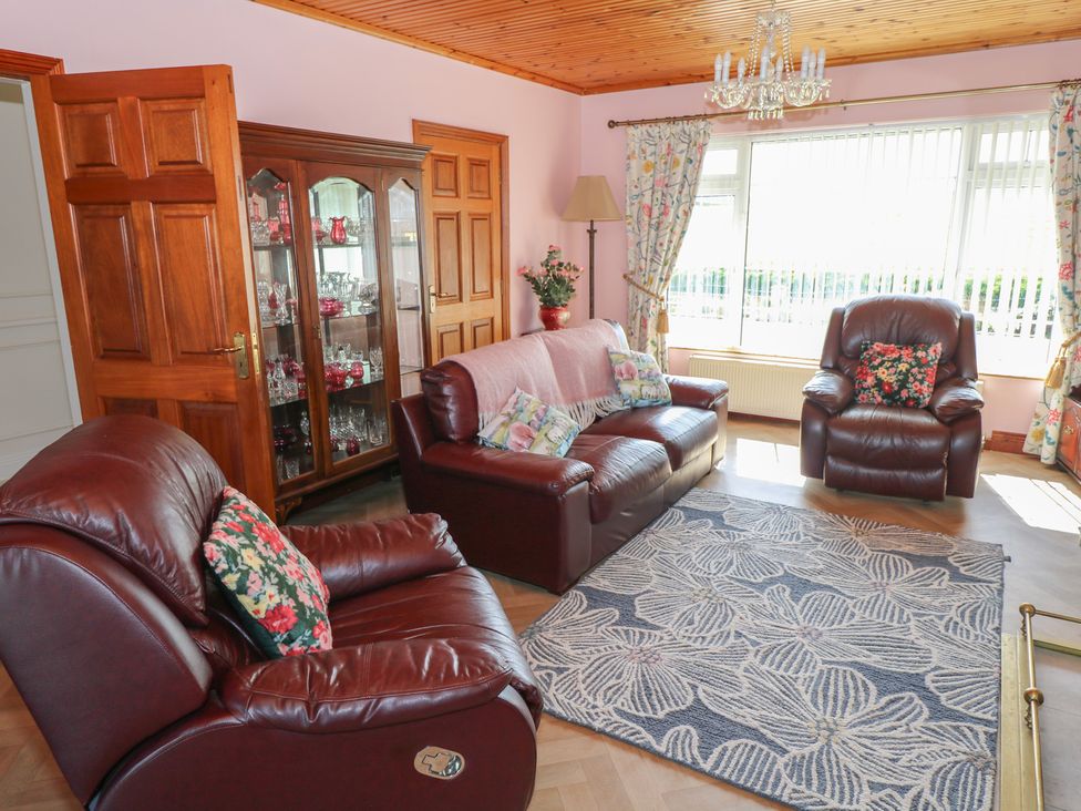 A living room with a sofa and armchairs at Marie's Country Home in Ardee, County Louth