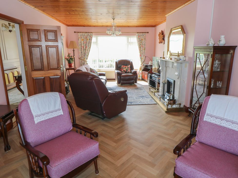 A living room with sofas and a fireplace at Marie's Country Home in Ardee, County Louth