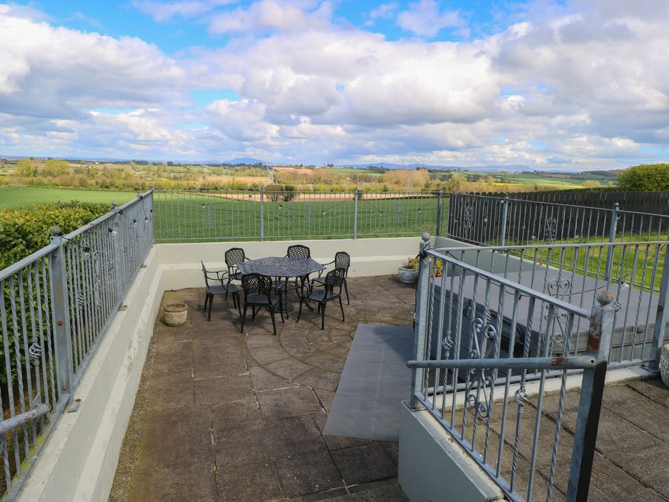 An outdoor seating area with a table and chairs at Marie's Country Home in Ardee, County Louth