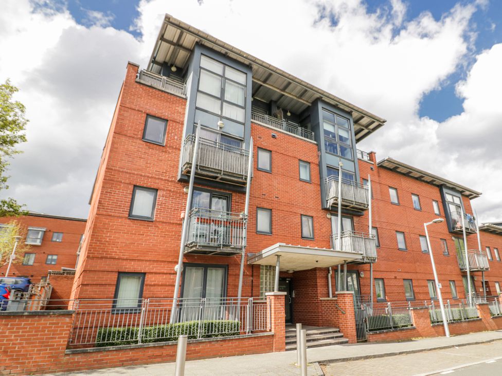 A building with balconies and entrance at Apartment 10 in Birmingham