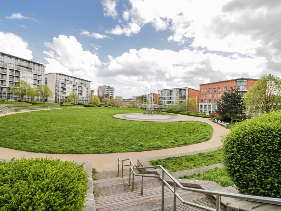 A landscaped outdoor area with grass and pathways at Apartment 10 in Birmingham
