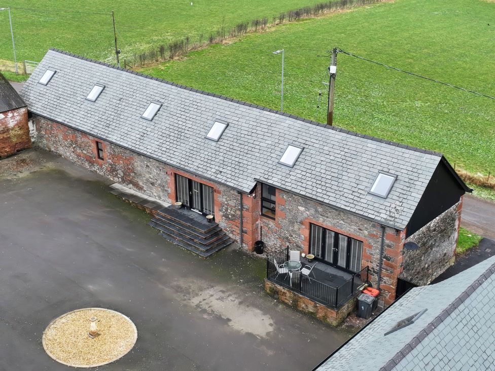 An outdoor view of a building with steps and windows at The Steading in Dumfries