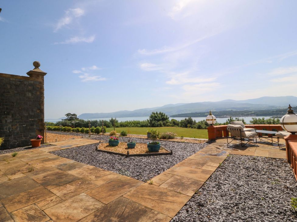 An outdoor area with a patio and view at Apartment 1, Bryn Mel Manor in Menai Bridge