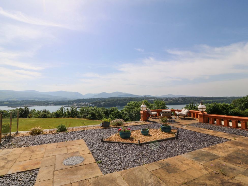 An outdoor view with a lake and mountains at Apartment 1, Bryn Mel Manor Menai Bridge