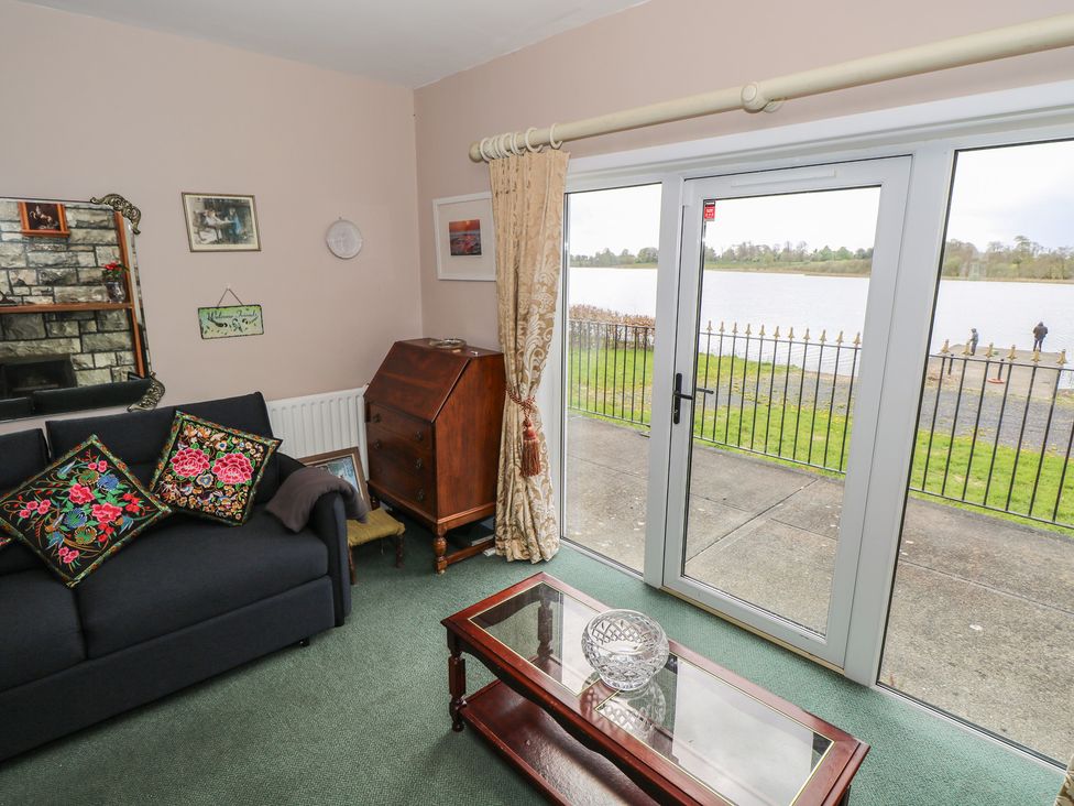 A living room with lake view and furniture at Sweetbriar Lodge Castlerea