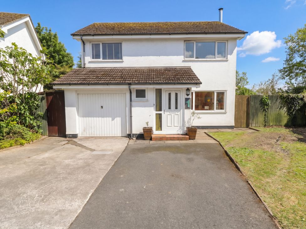 A house with a garage and driveway at 1 Rosemount Garden Villas Tenby