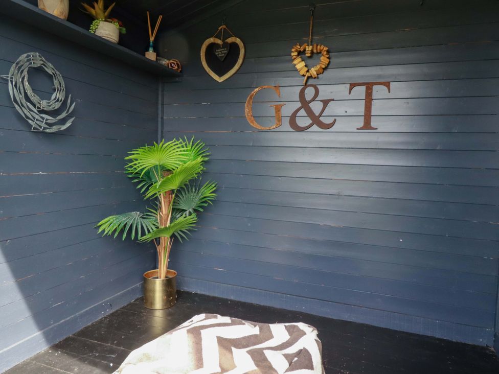 A corner with a plant and decor at No.45 Whealgolden Drive in Newquay