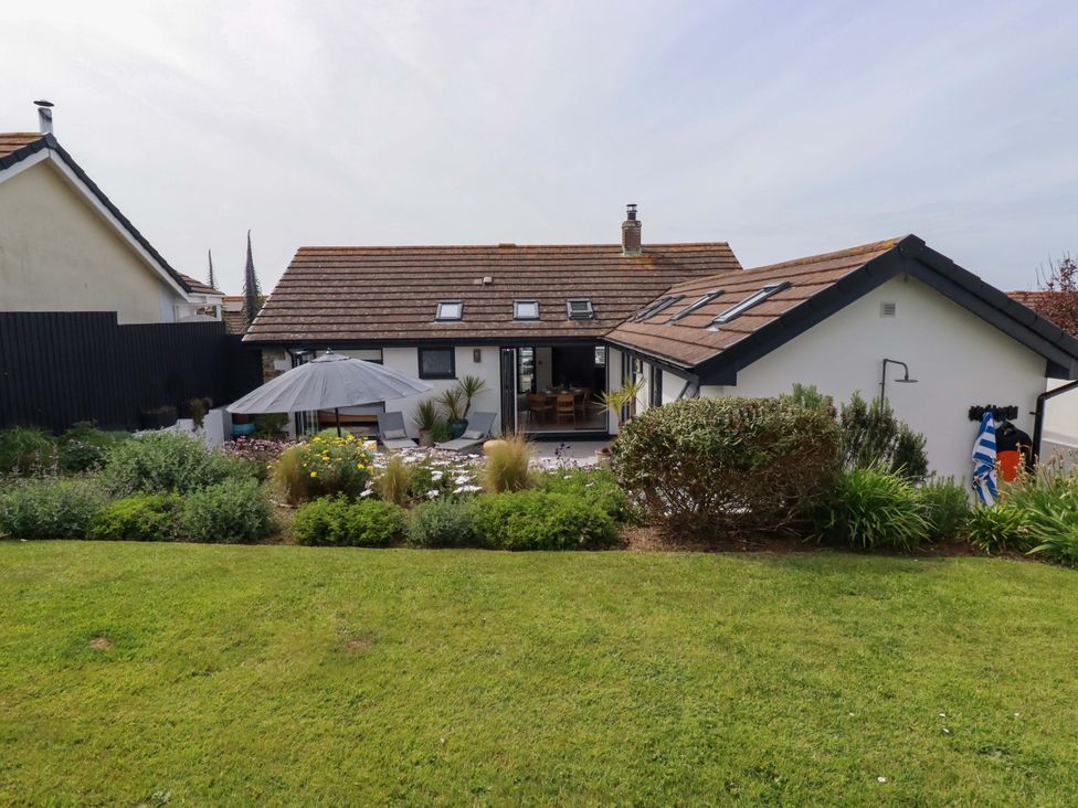 A house with a garden and patio furniture at No.45 Whealgolden Drive Newquay