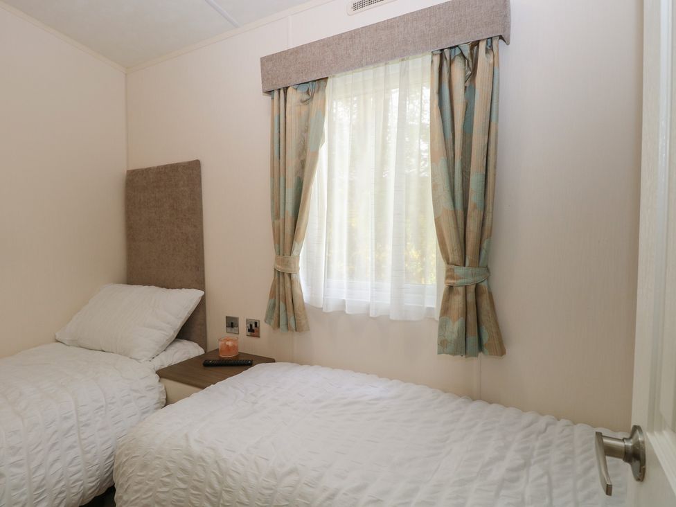 Two single beds in a bedroom at The Norfolk Nook 18 Castle Walk Burgh Castle
