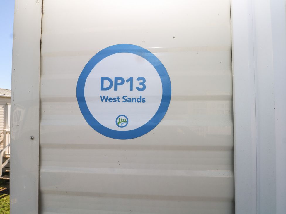 A sign displaying DP13 West Sands at Seaside Retreat in Selsey