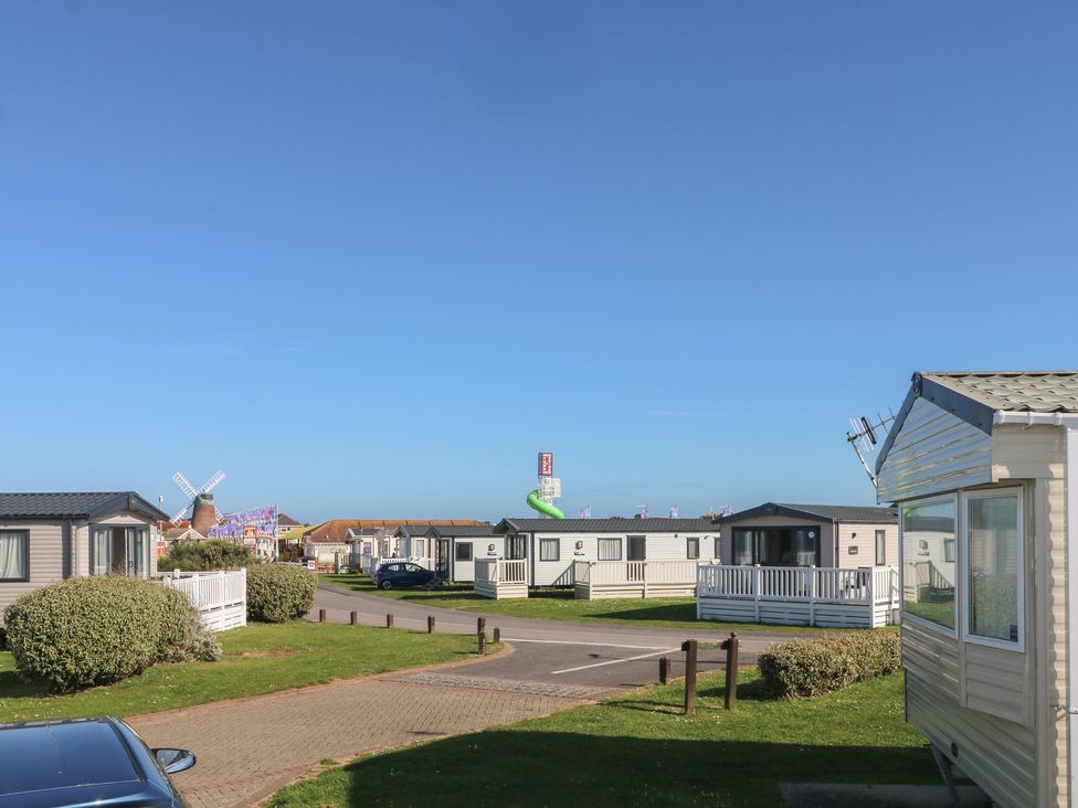 Static caravans lined along a roadway at Seaside Retreat in Selsey