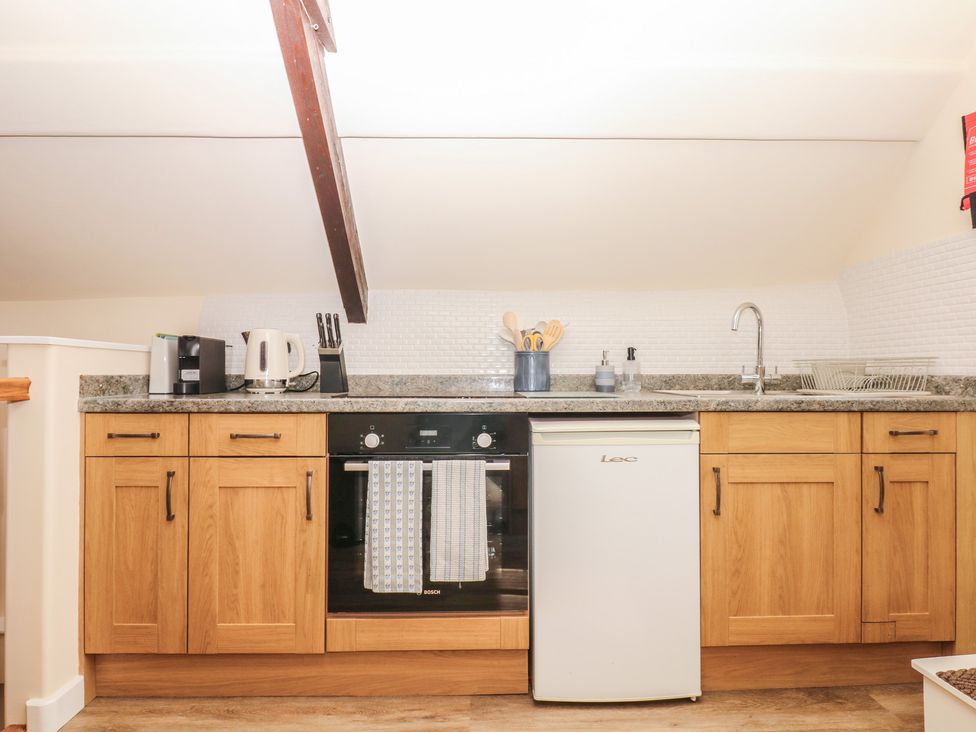 A kitchen with appliances and utensils at The Mill Barn in Lustleigh