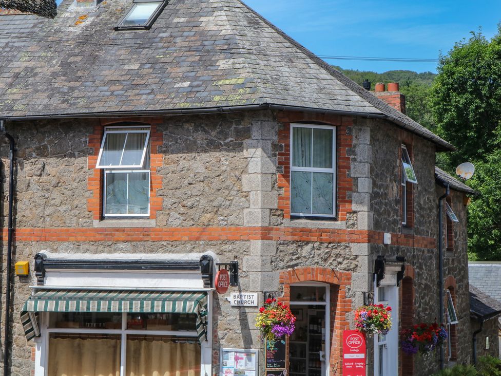 A building with windows and a sign at The Mill Barn in Lustleigh