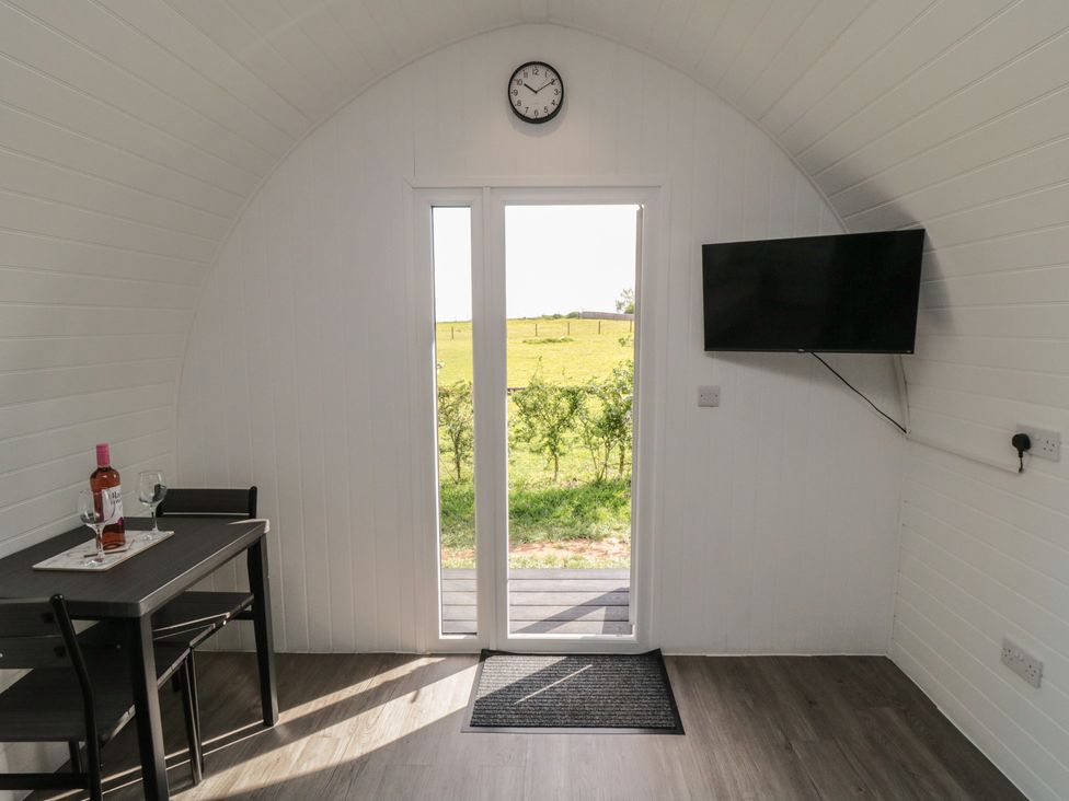 A room with a table and chairs at Natures Nest in Malton
