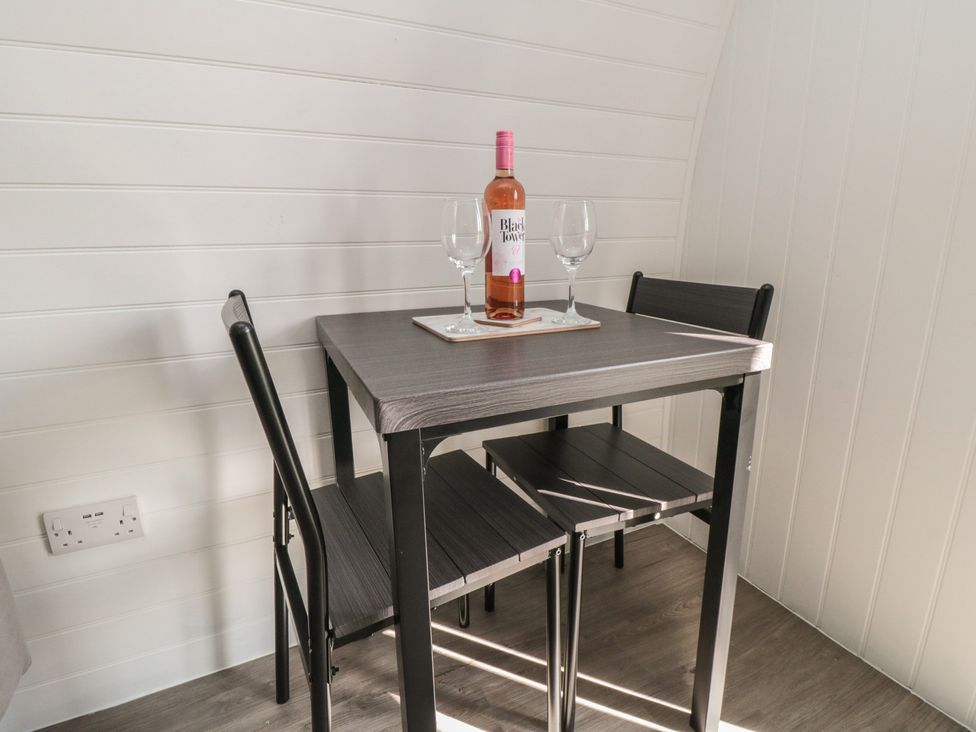 A dining area with a table and chairs at Natures Nest in Malton