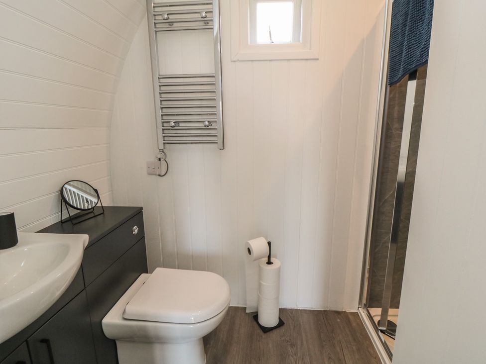 A bathroom with toilet, sink, and shower at Natures Nest in Malton
