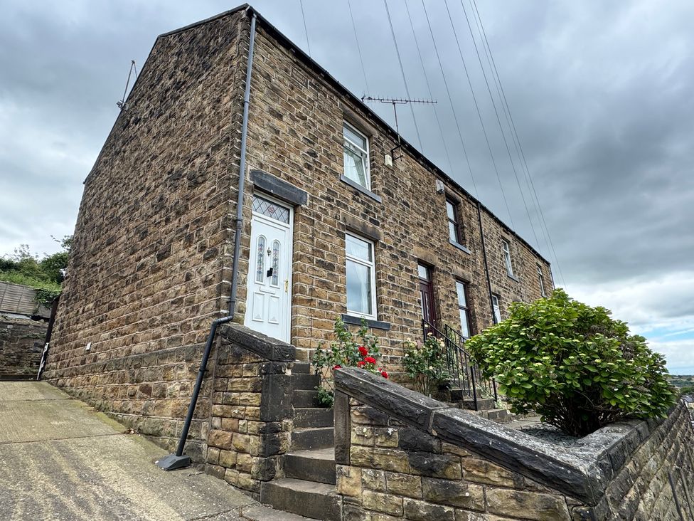 A house with a garden and steps at Herbert Terrace in Dewsbury