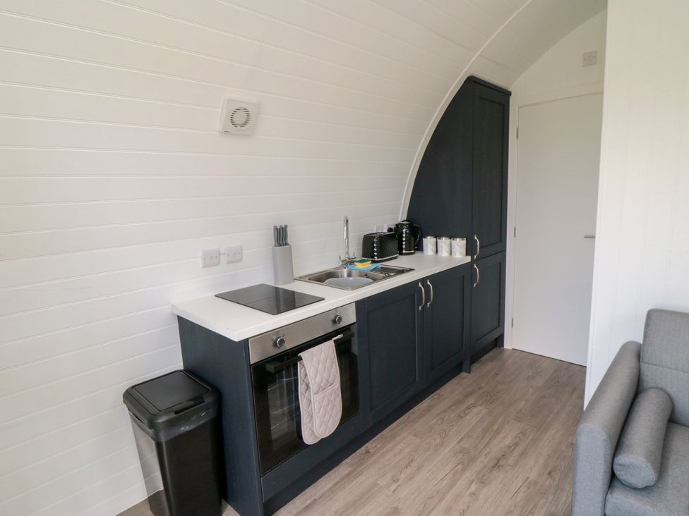 A kitchen with sink and stove at Starlight Sanctuary in Malton