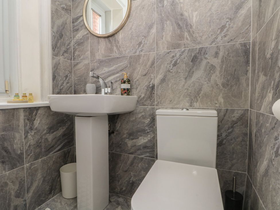A bathroom with a sink and toilet at Apartment 4 in Lytham St. Annes