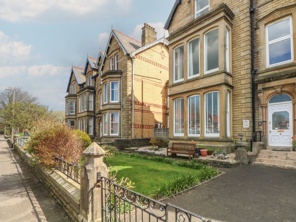 A building with windows and a garden at Apartment 4 in Lytham St. Annes