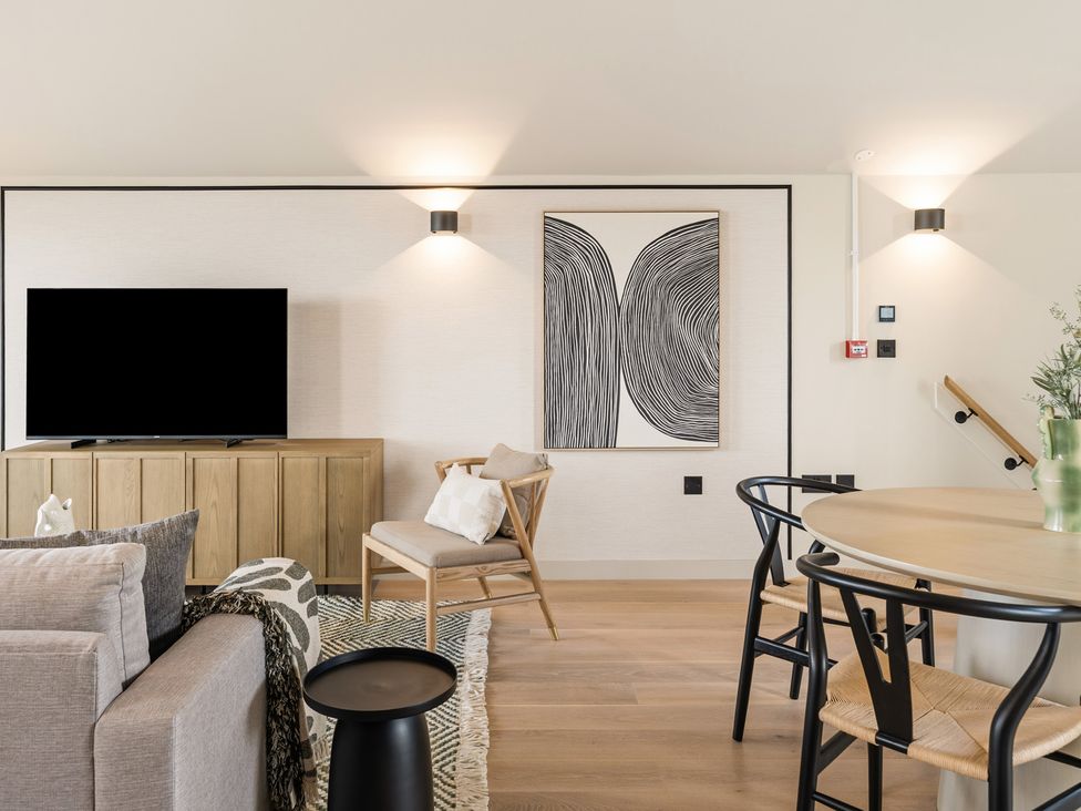 A living room with a television and furniture at tbc St. Ives