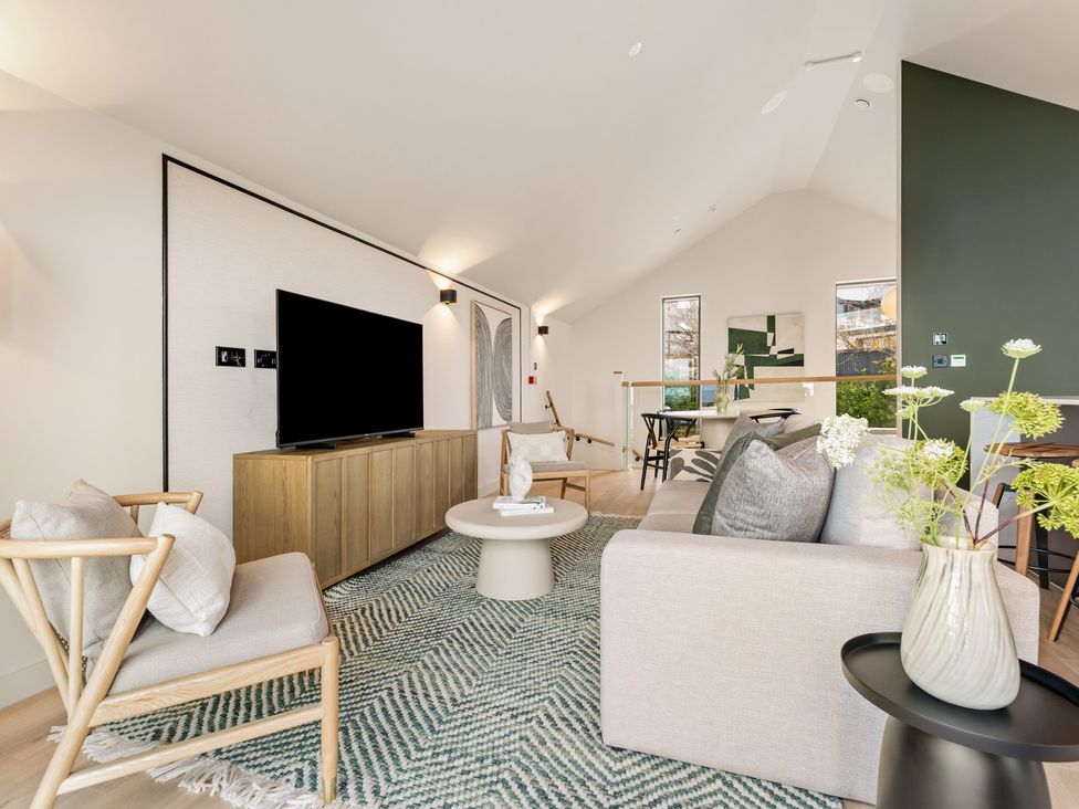 A living room with a television and sofa at tbc St. Ives