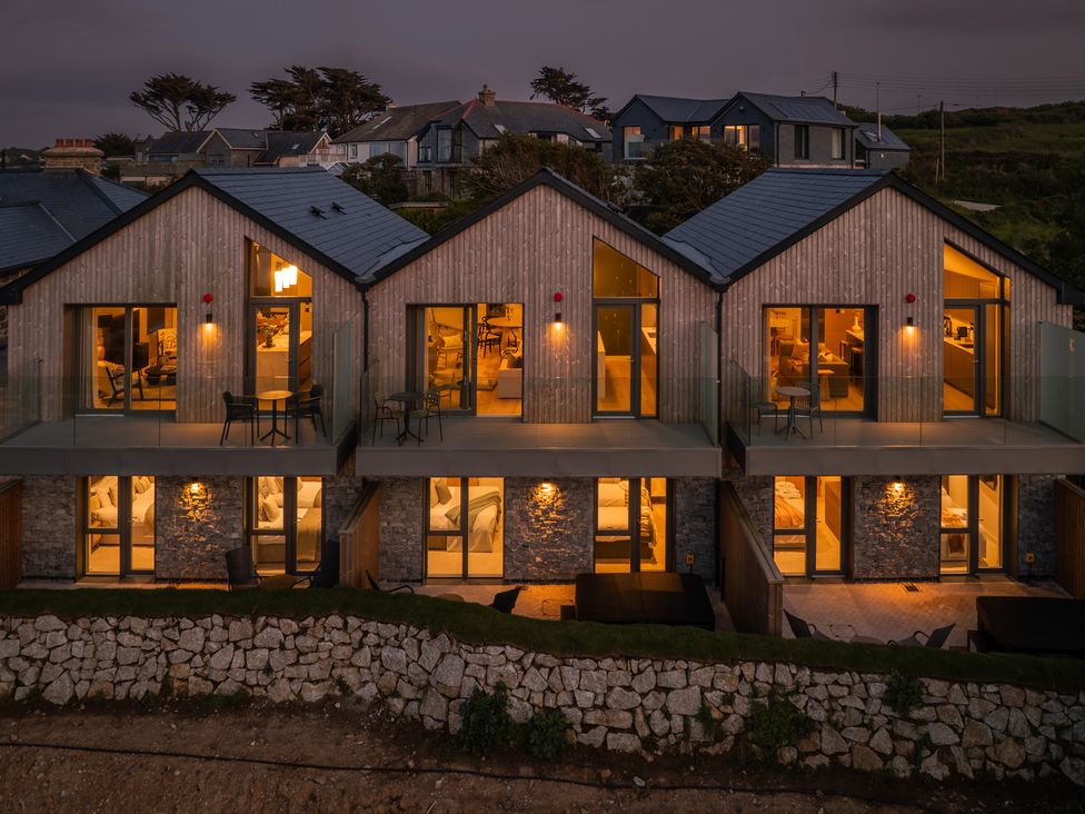 A view of houses with balconies and outdoor furniture at Hidden 2- Bay House Hot Tub in St Ives