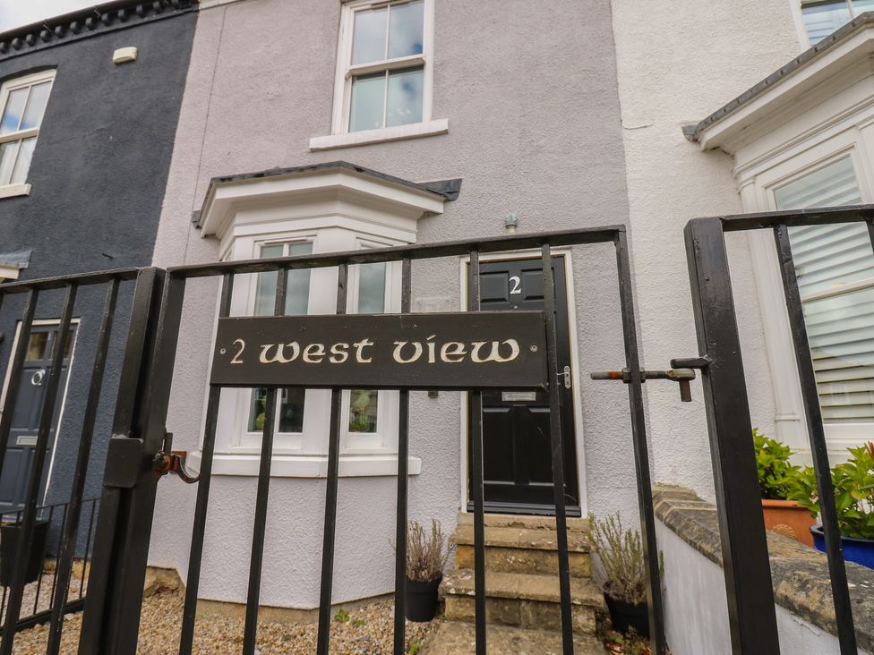 A house exterior with a gate and door at 2 West View in Richmond