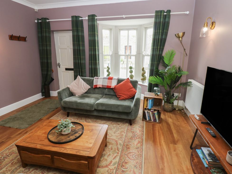 A living room with a sofa and coffee table at 2 West View in Richmond