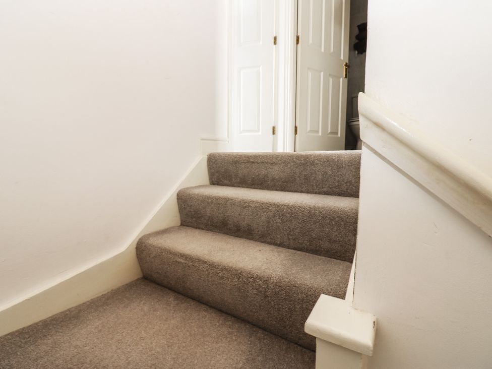 A staircase leading to a door at 2 West View, Richmond