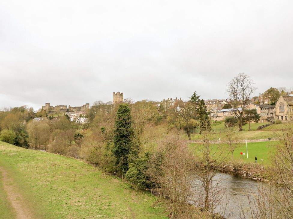 A landscape with a castle and buildings near a river at 2 West View Richmond