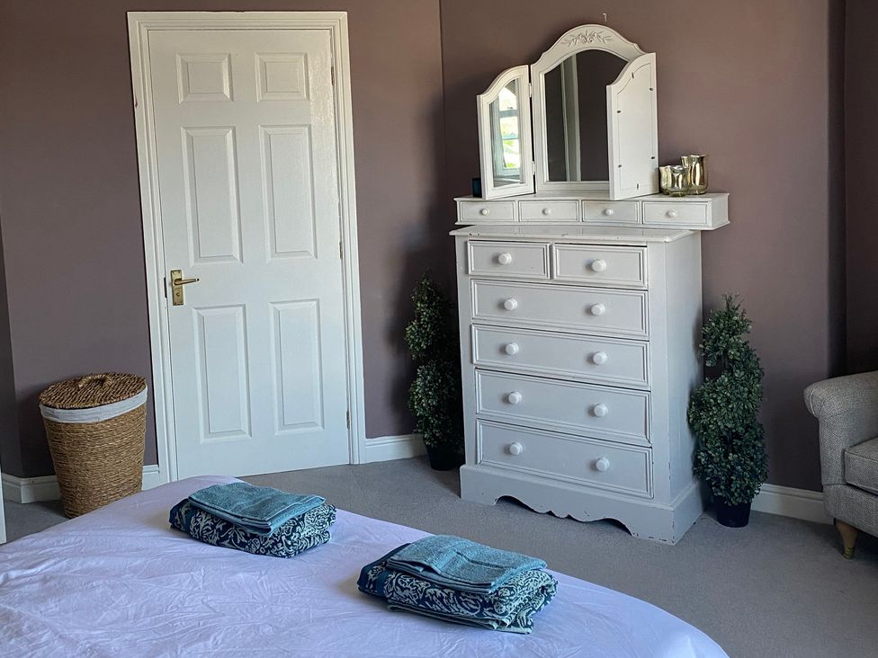 A bedroom with a bed and dresser at 2 West View Richmond